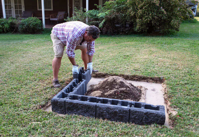 Jason Hidges building a backyard fire pit