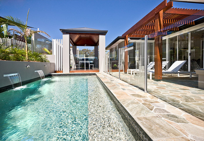 landscaped swimming pool with pergola