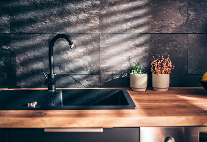 Black kitchen sink for a moody space