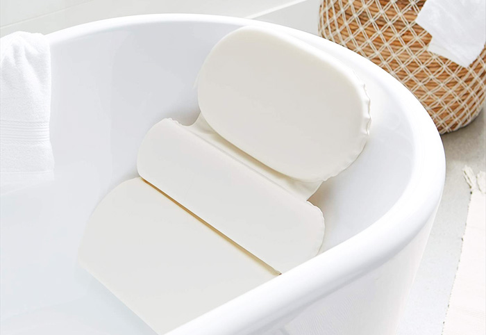 Padded pillow in a white tub. 