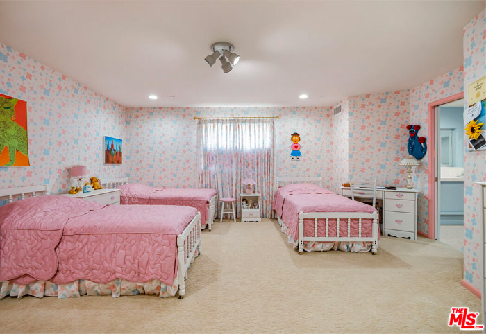 Pink twin beds in the Brady Bunch house.
