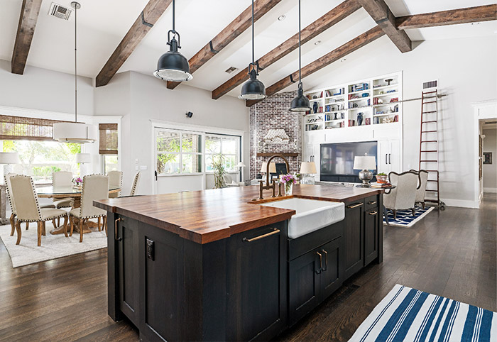 Exposed wooden beams in a Hamptons-inspired kitchen.