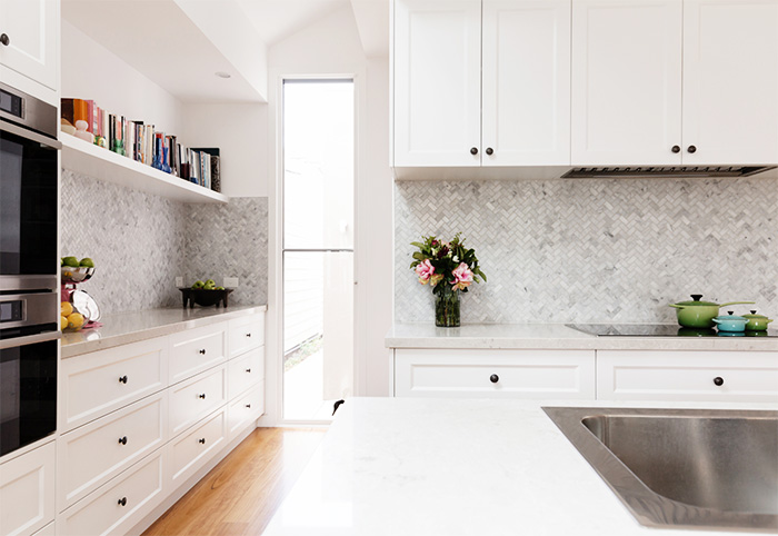 Grey herringbone tiled splashback in a modern Hamptons kitchen.