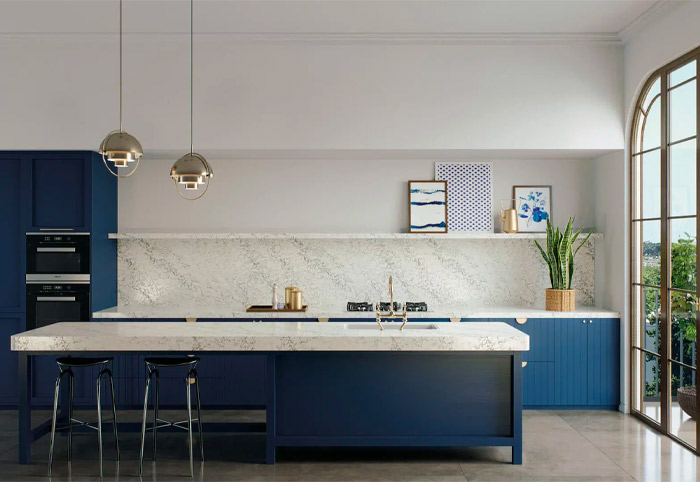 Luxurious modern kitchen with blue cabinets and large island bench.