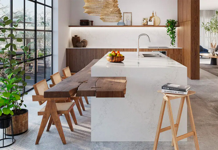 White Caesarstone waterfall benchtop with timber shelf built into it.