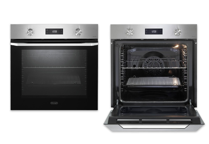 Two ovens side by side, one closed and one open.