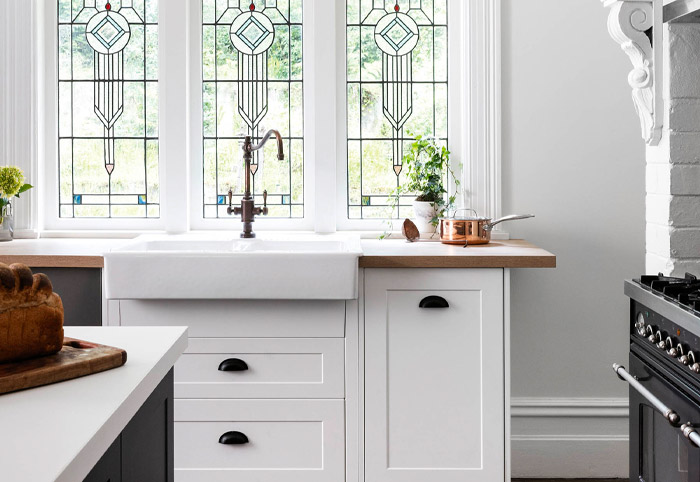 Modern country kitchen with a farmhouse sink and statement tap.