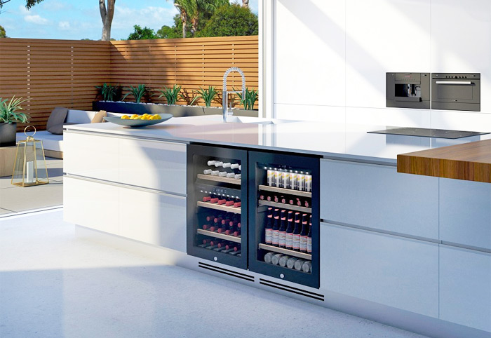 Vintec wine fridge integrated into a white outdoor kitchen bench.