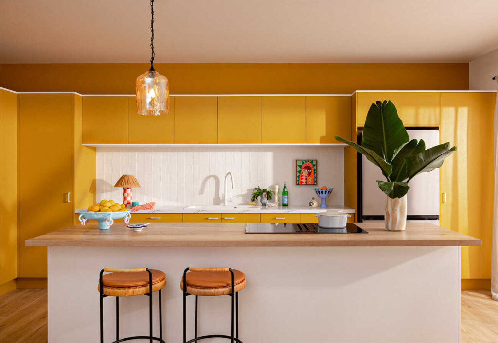 Kaboodle Trends kitchen featuring mostaza-coloured cabinets and a wooden benchtop.