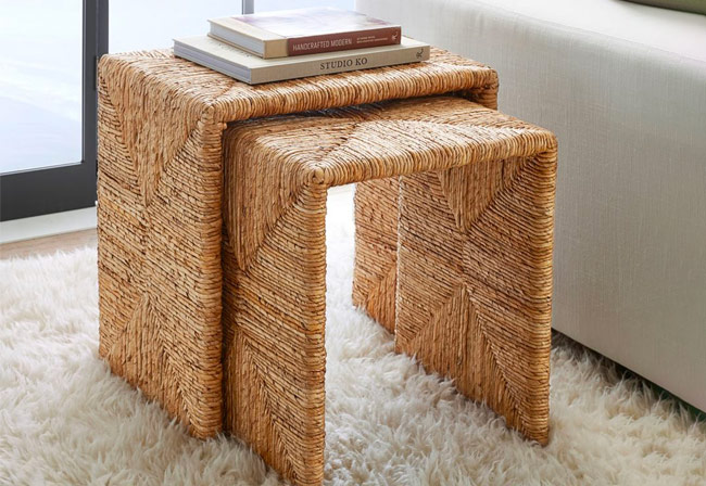 Woven set of tables with books on top of them.