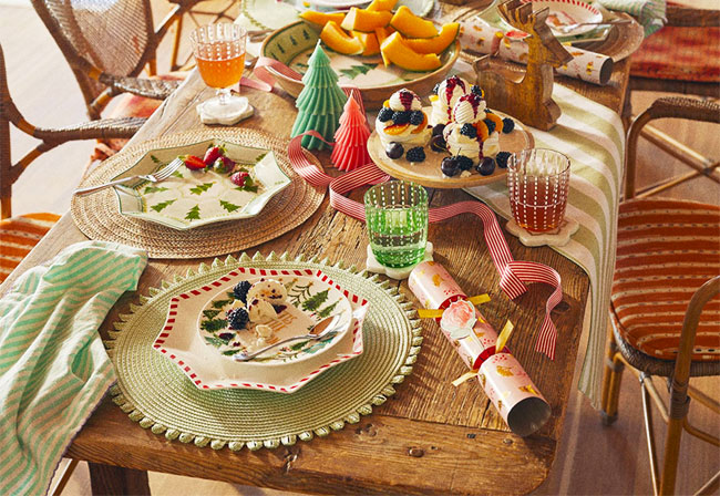 A Christmas table decorated with Adairs tableware.
