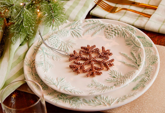 A set of Christmas tableware with decorations.