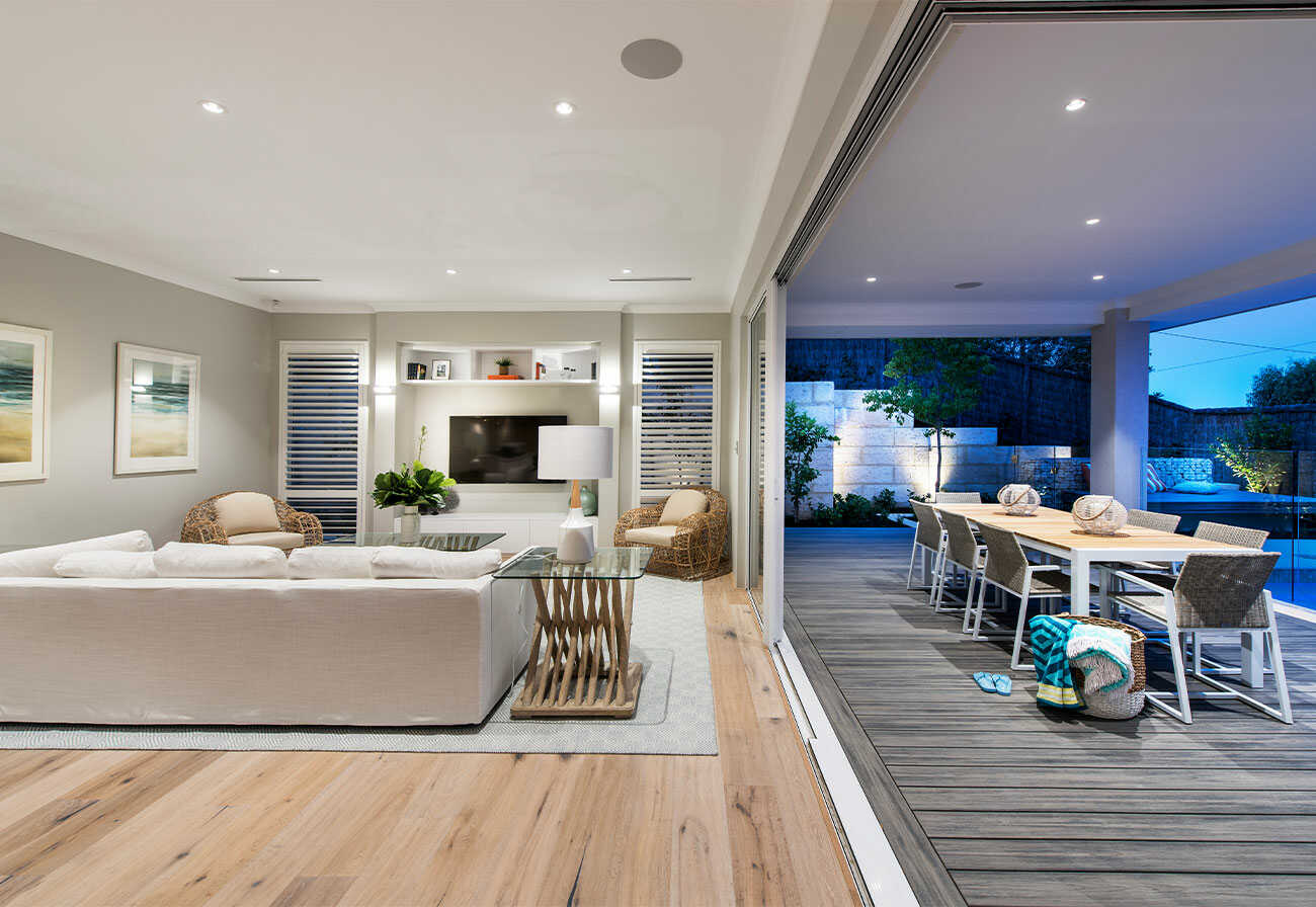 Living room and outdoor deck of a modern home.
