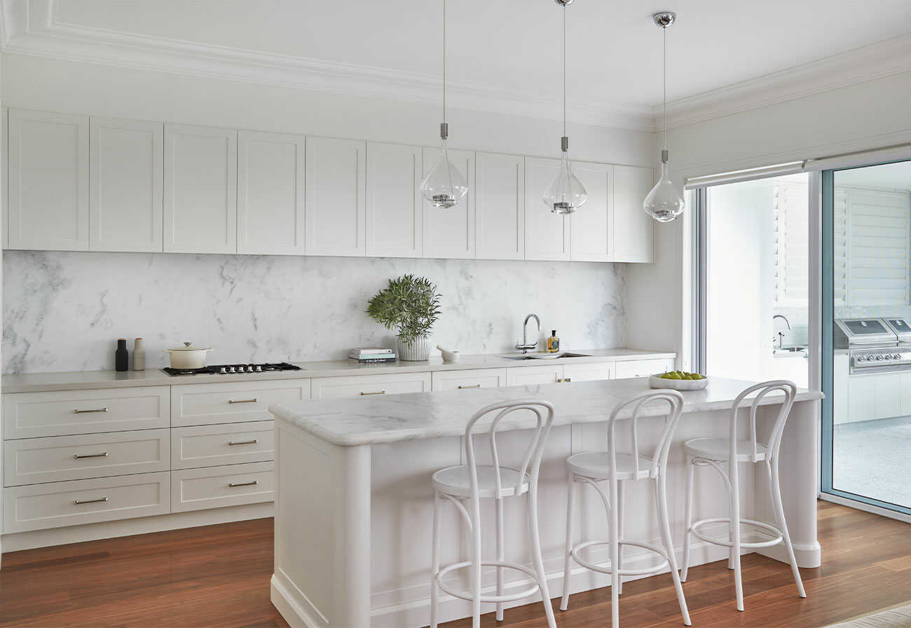 Modern, white kitchen inspired by feng shui techniques.