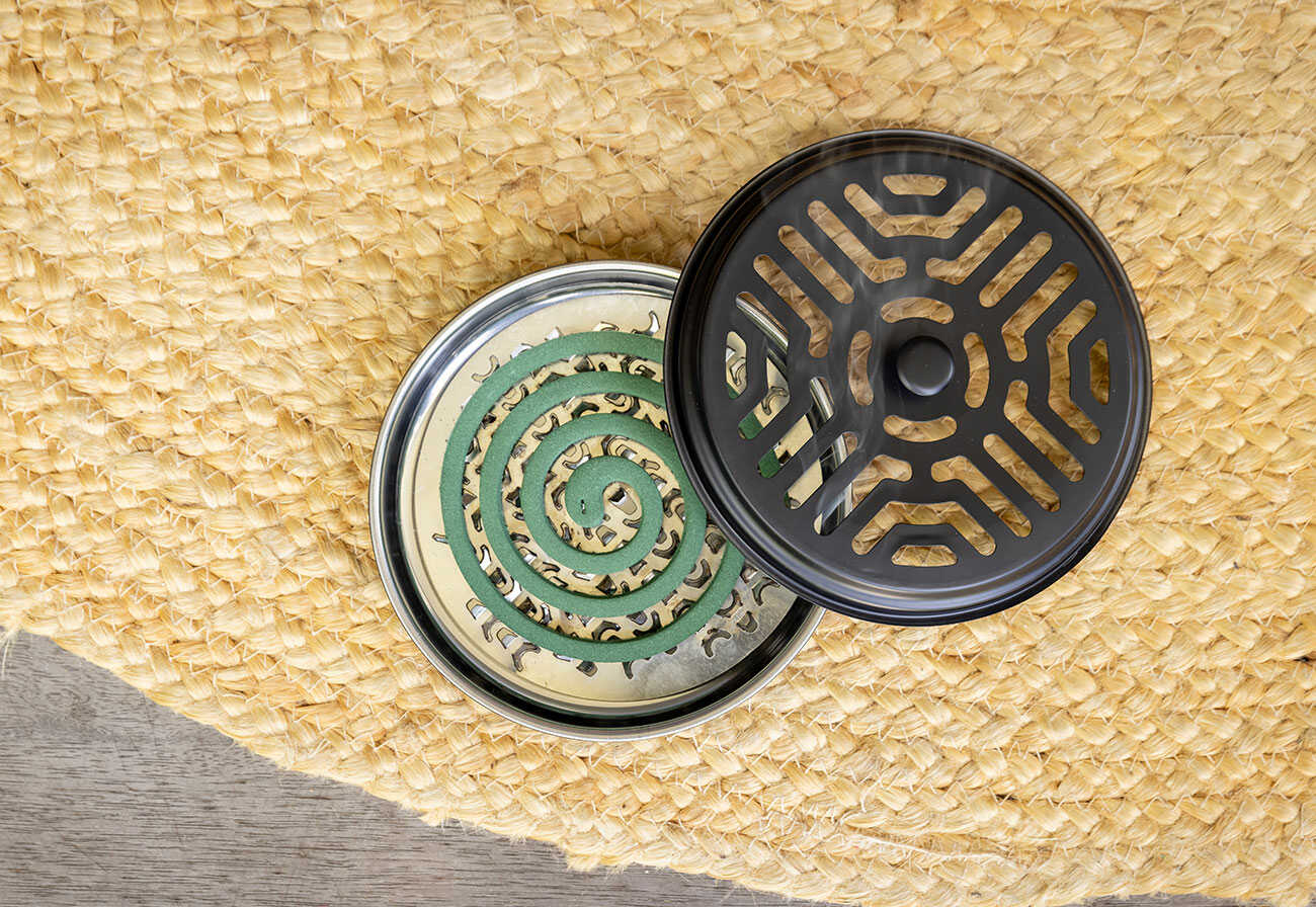 Mosquito coil diffuser on a jute rug. 