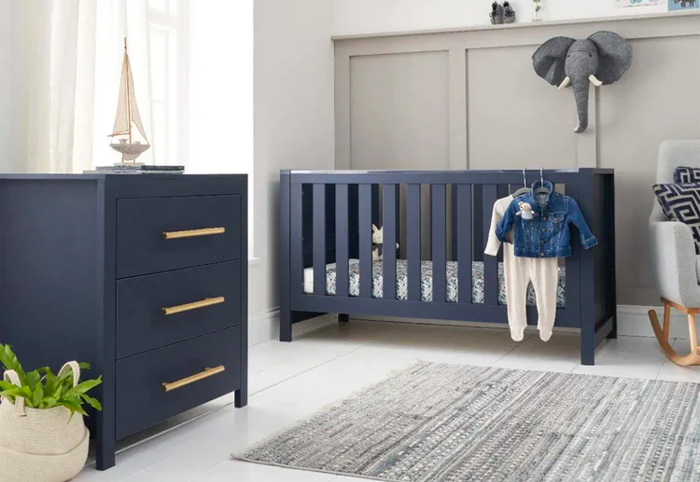 Navy blue Tivoli nursery package including a cot and chest of drawers.