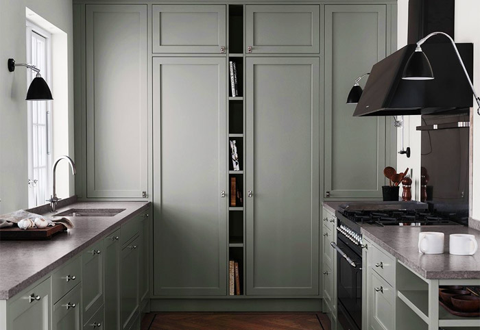 Green shaker-style doors and cabinets from Nordiska Kok.