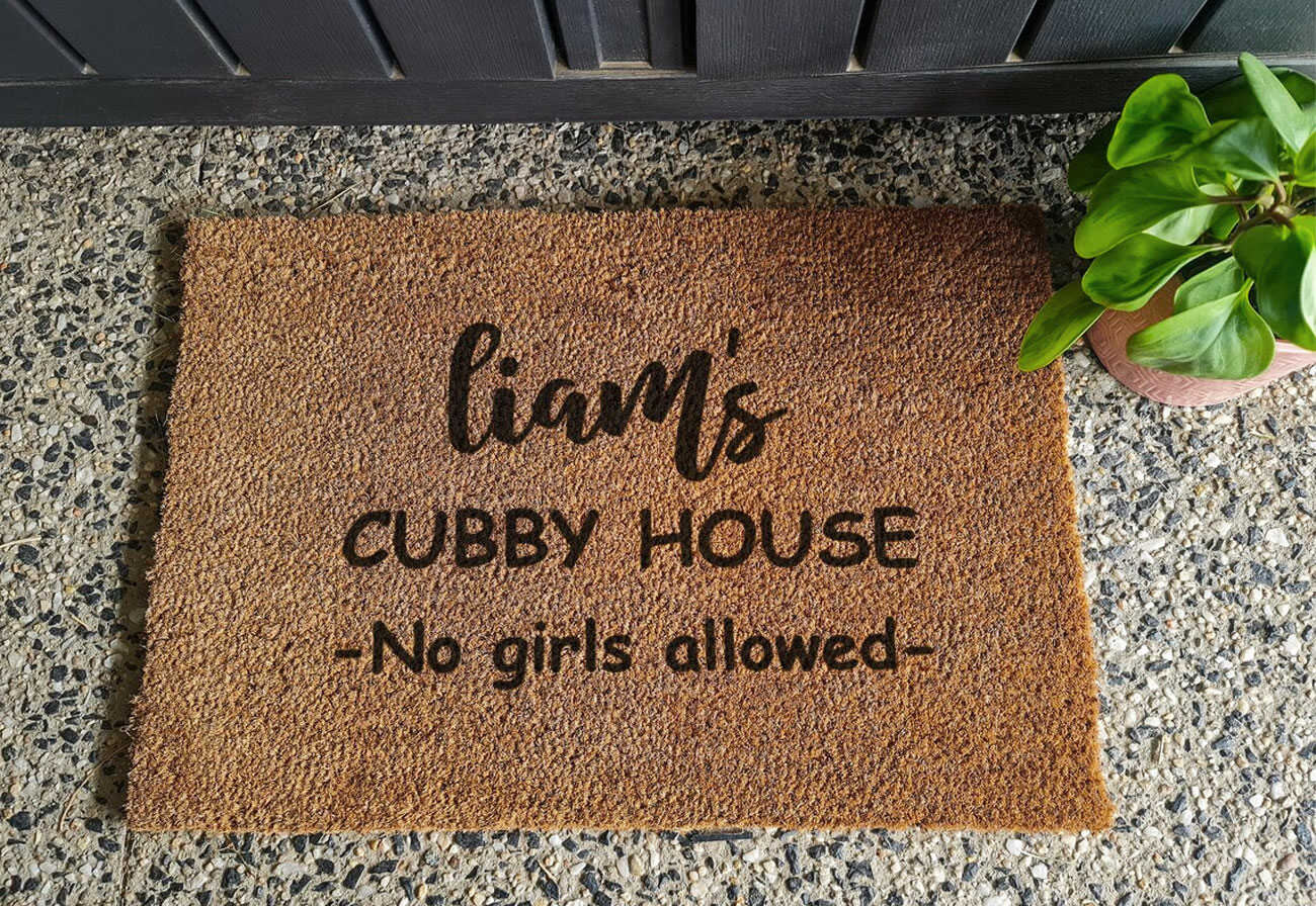 Personalised kids' doormat for a cubby house.