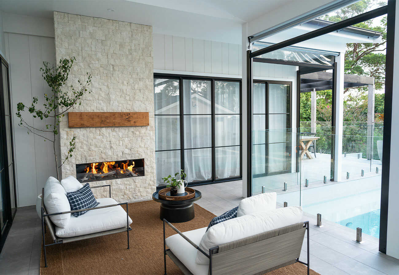 A covered alfresco area with working fireplace.