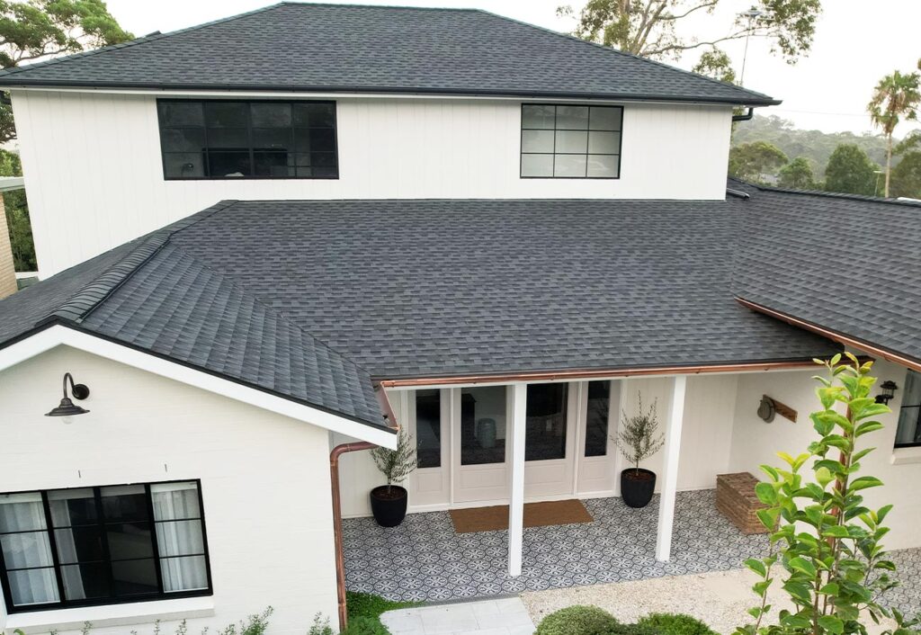 Renovated home exterior with asphalt shingles on the roof.