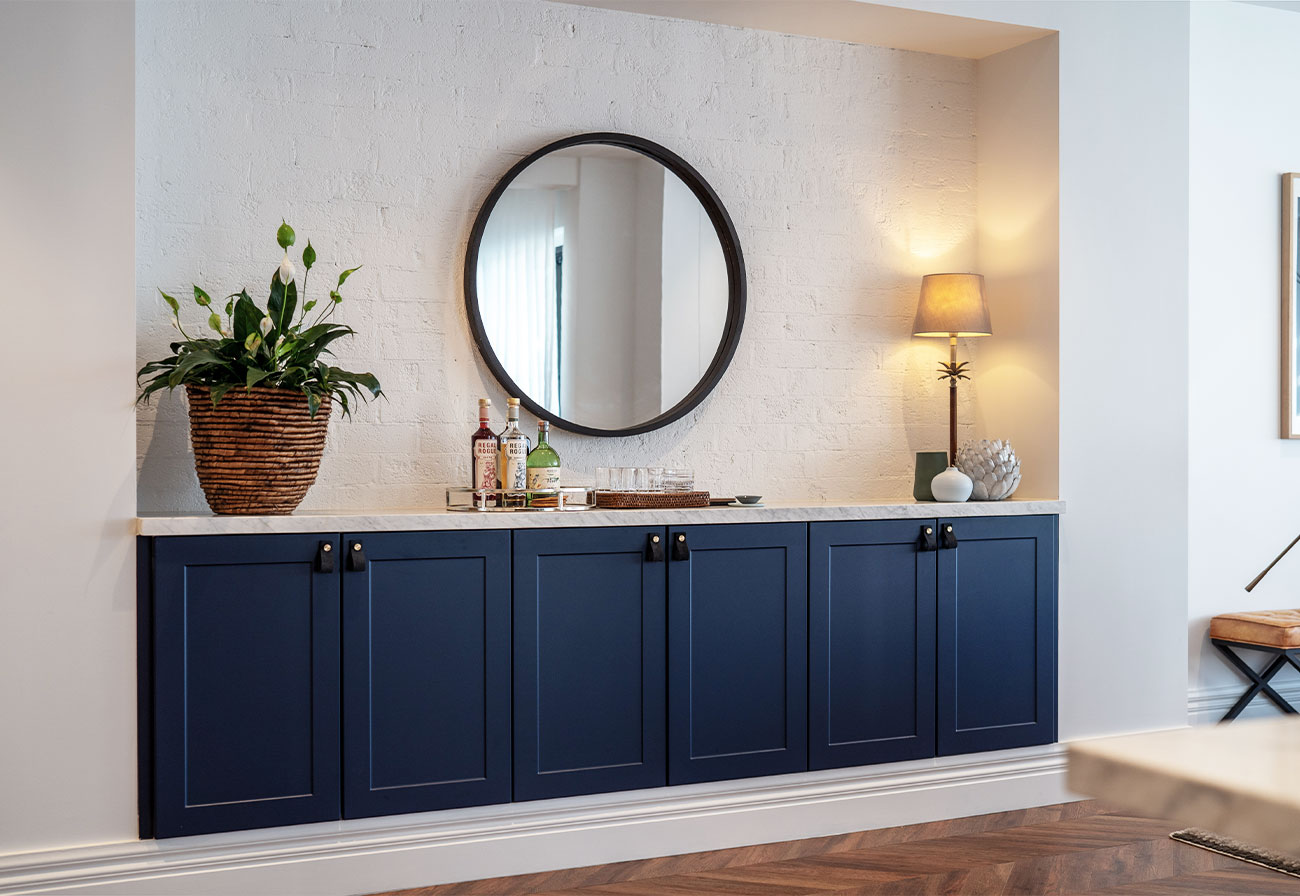 Built-in sideboard with navy blue cabinets.