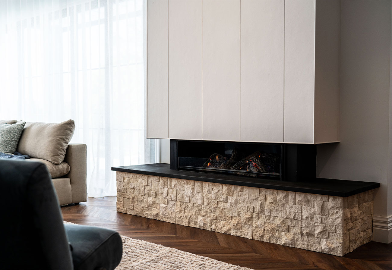 Modern built-in fireplace with interior cladding above.