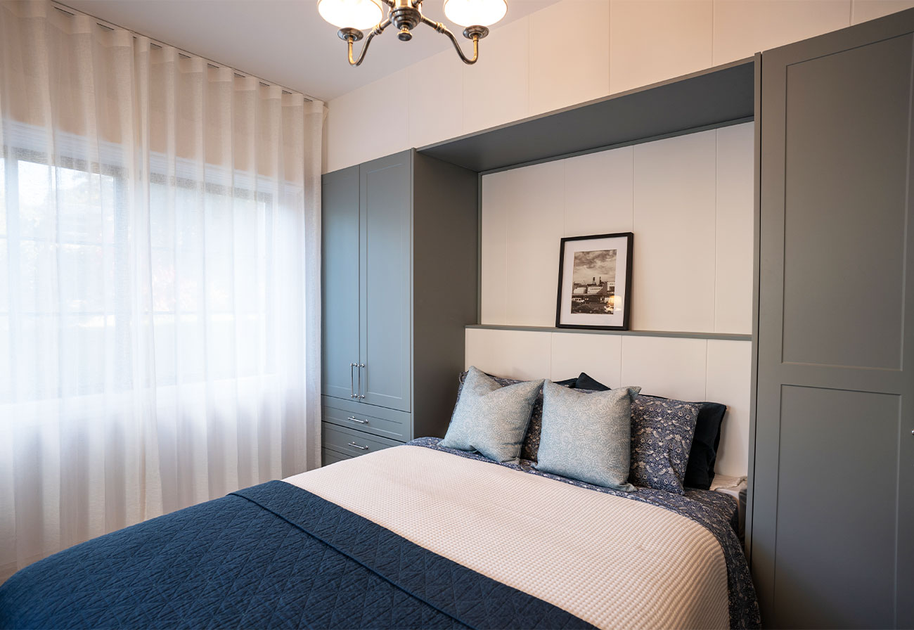 Fold-down wall bed in a modern farmhouse study.