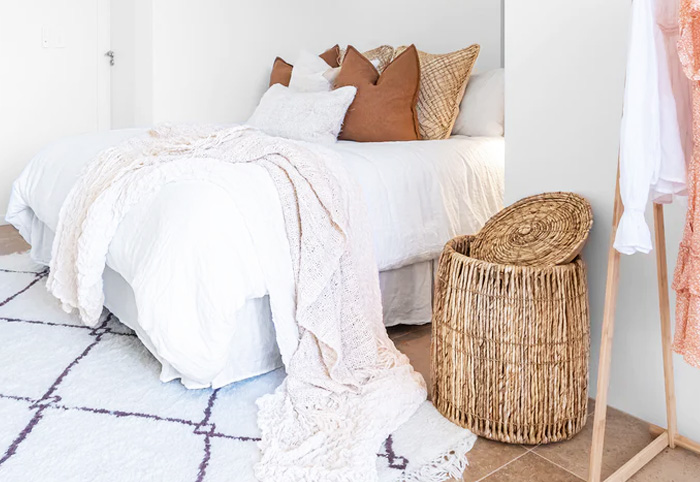 Uniqwa Cancun Laundry Hamper in a bedroom.