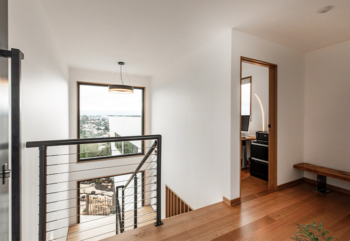 Upstairs landing with wooden floors.