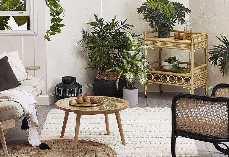 Kokomo rattan bar cart in a living room.