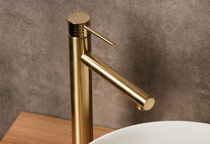 Brushed brass basin mixer.