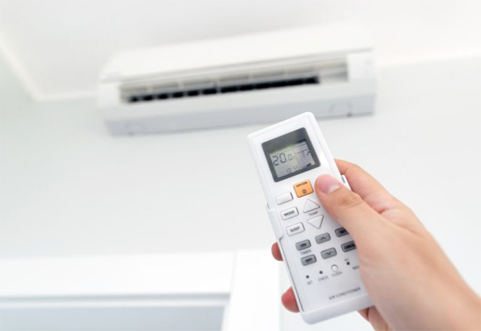 Remote control points to a wall-mounted air conditioner.