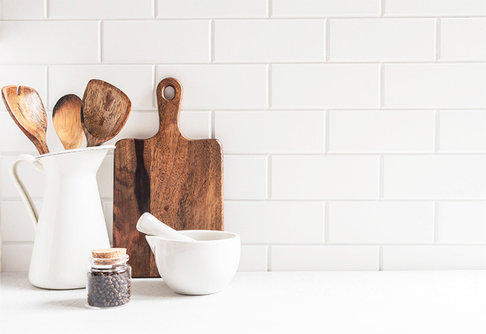 Kitchen splashback with white subway tiles.