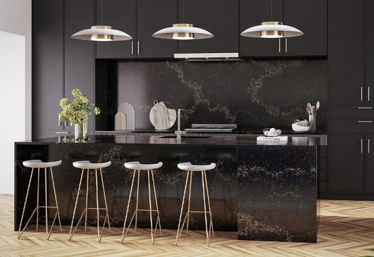 Luxurious black stone kitchen with waterfall island.