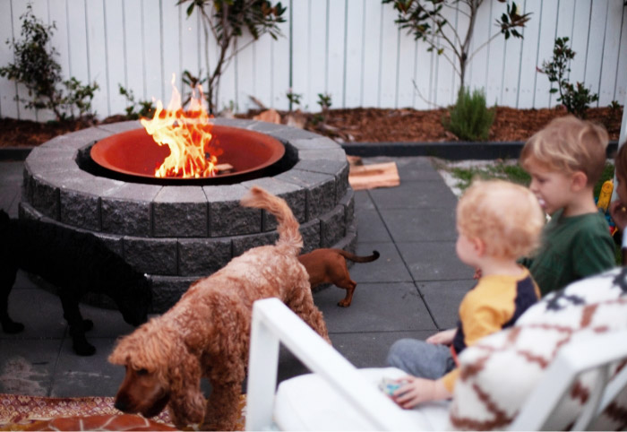 Kids and pets around Adbri Masonry Miniwall Fire Pit.