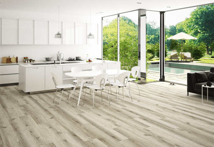 Light-coloured hybrid floorboards in a modern white kitchen.