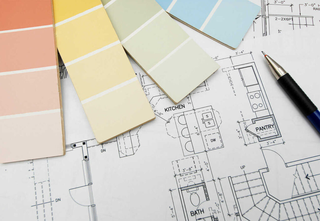 Coloured paint swatches on top of house plans.