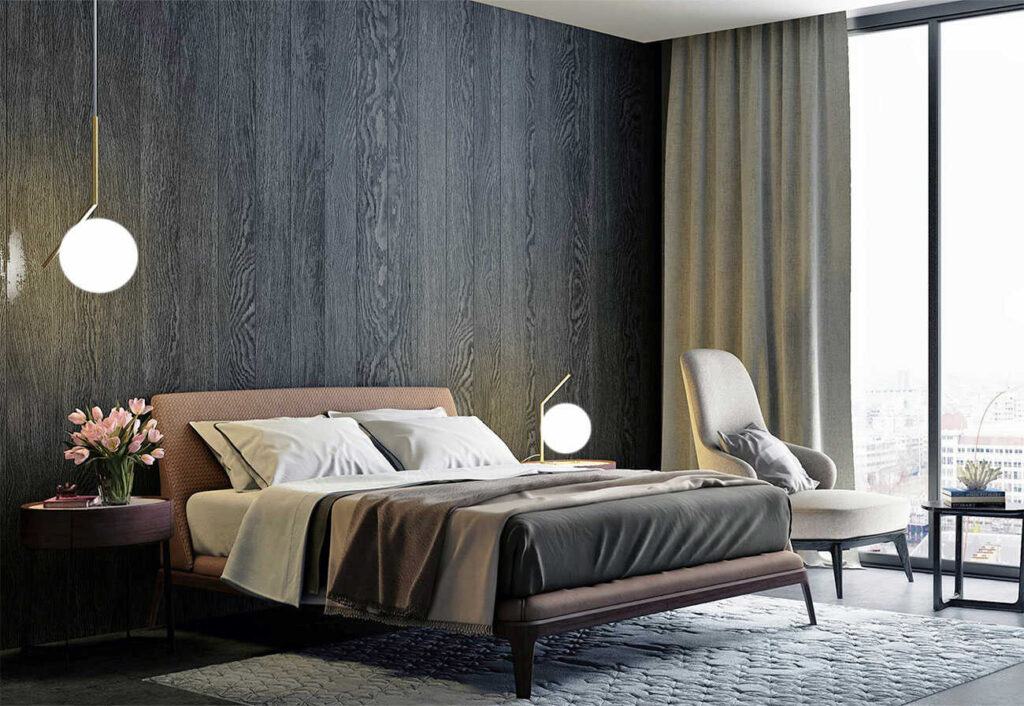 A brown upholstered bed against a black timber wall in a modern bedroom.