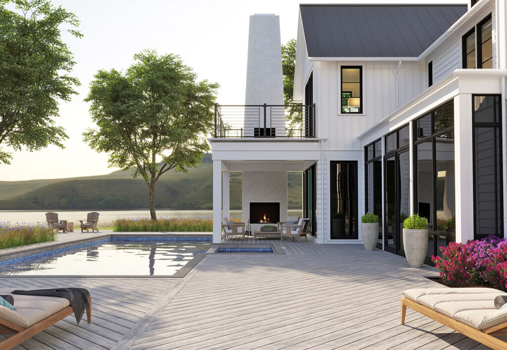 Patio of a two-story weatherboard house with an in-ground pool and luxury deck.