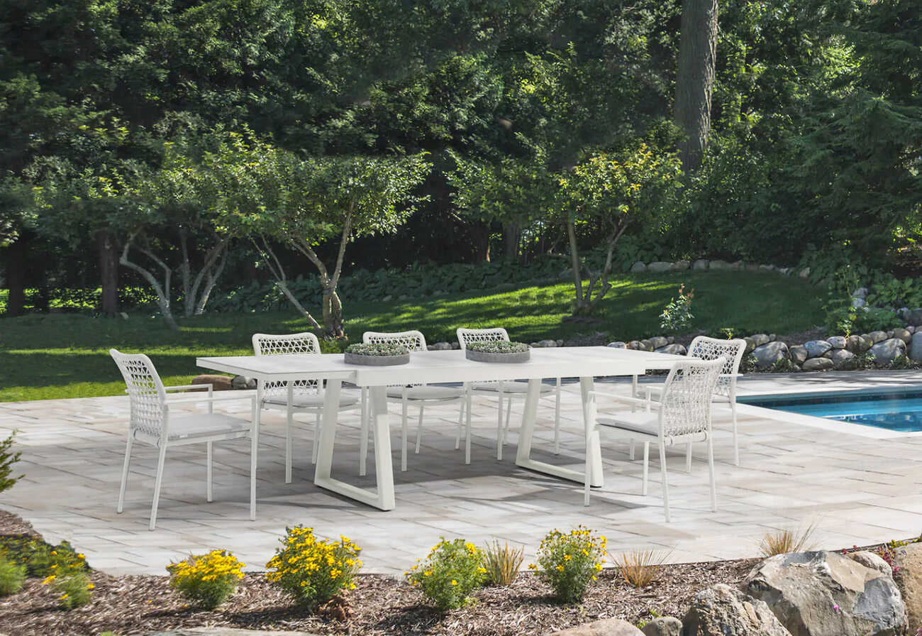 Luxe patio with a swimming pool, paved area and garden.