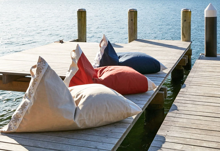 Outdoor bean bags on a pier.