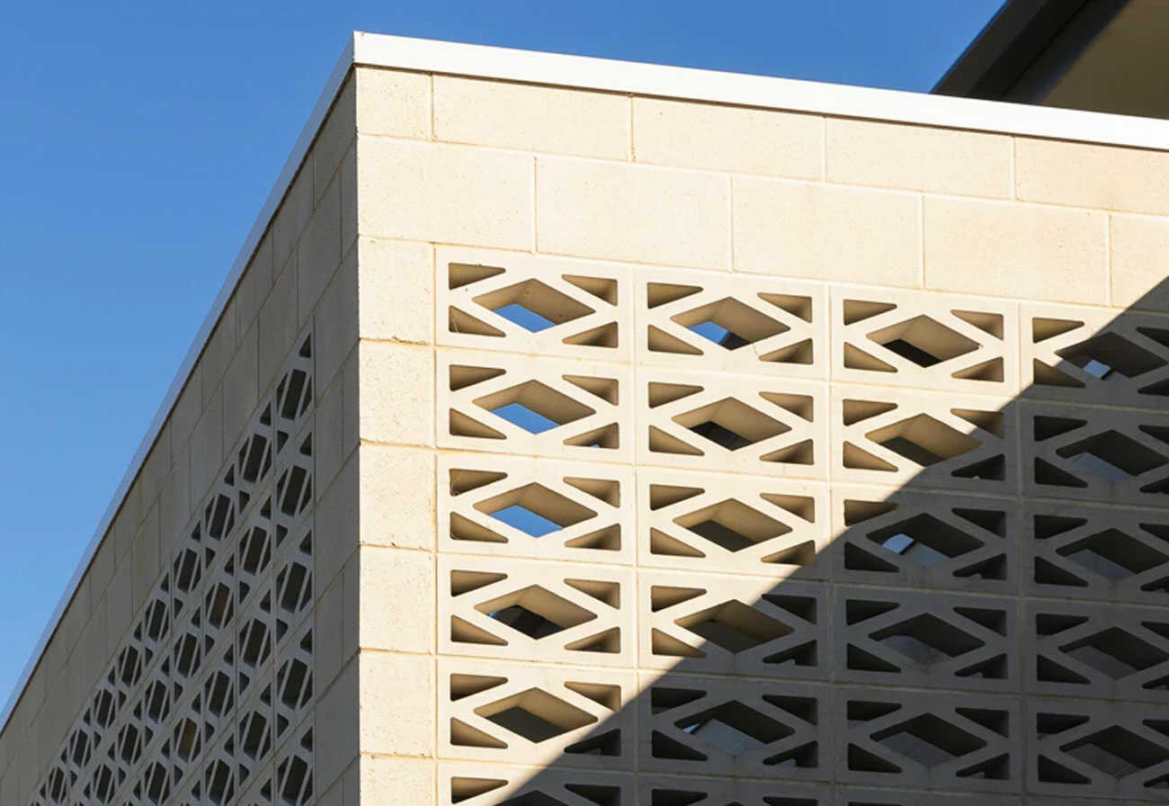 Corner of a wall made of breeze blocks.