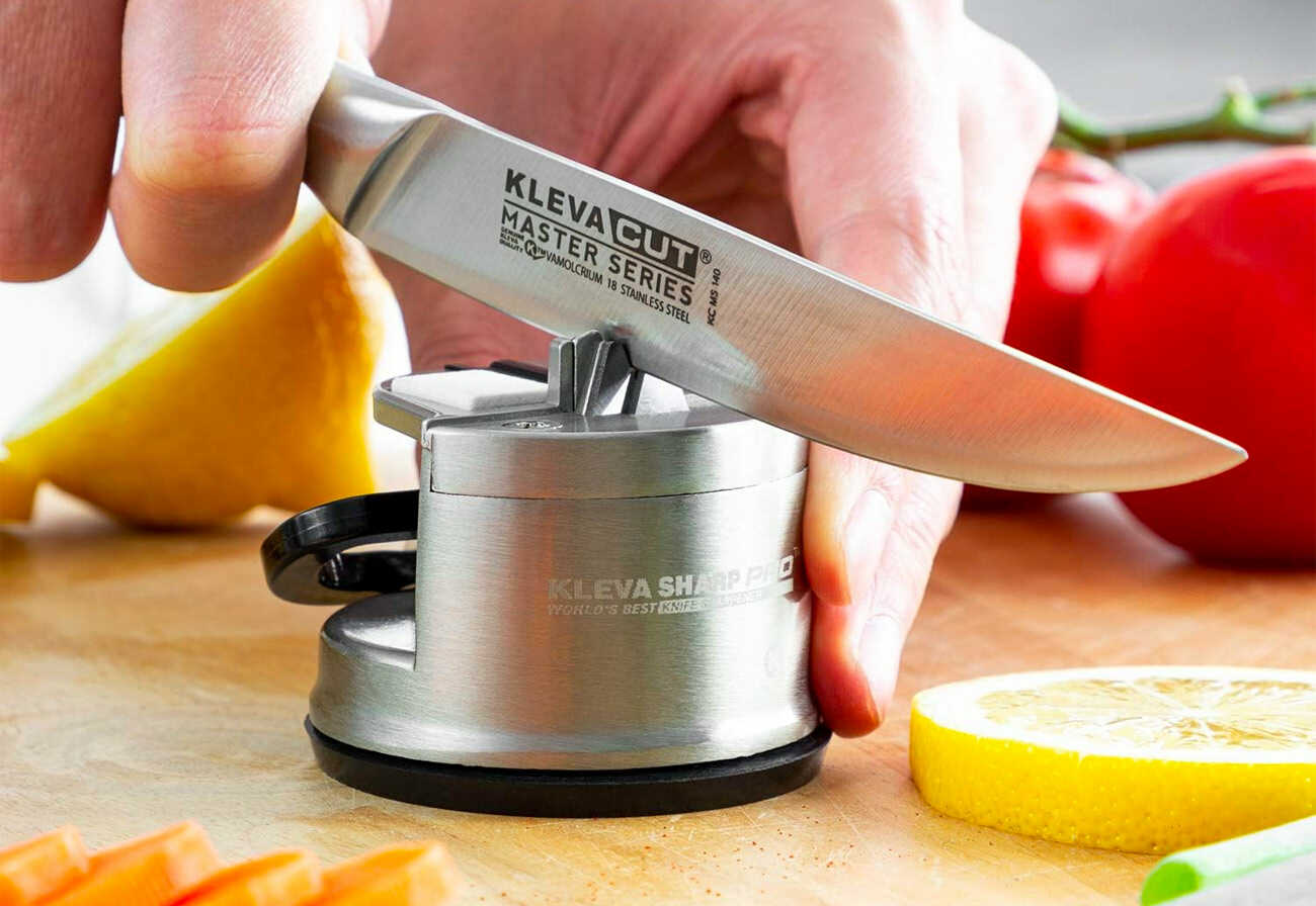 Kleva knife sharpener in use at a kitchen bench.