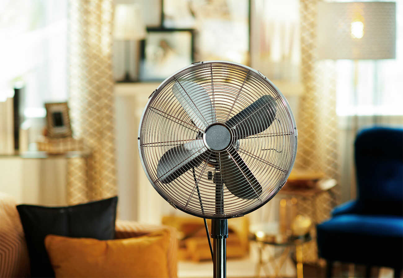 Metal floor fan in a living room.