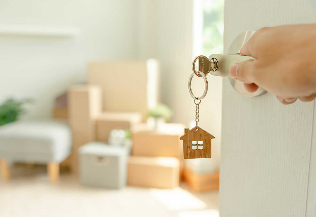 Opening a front door to a living room.