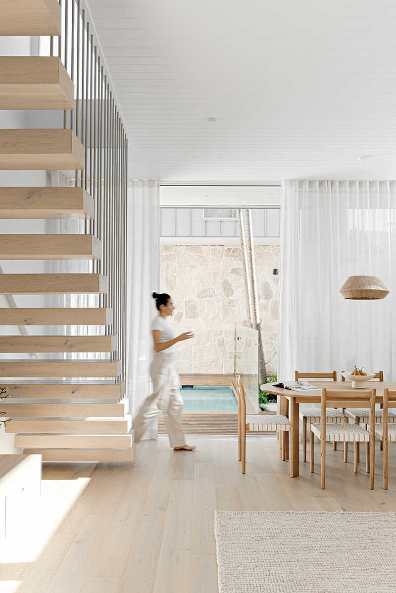 Floating staircase in a modern living room.