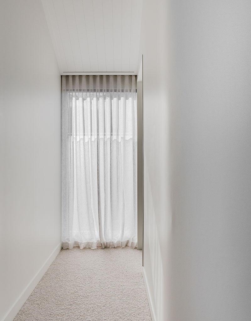 Upstairs void with curved plaster wall.