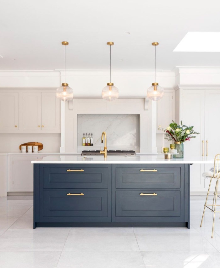 White kitchen with navy bench by Harvey Jones Kitchens.