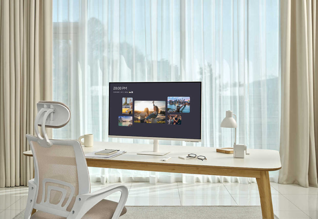 The Samsung Smart Monitor on a table with a personalised display. 