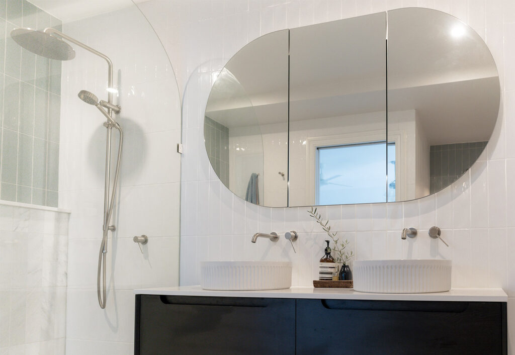 Modern bathroom with brushed nickel tapware.